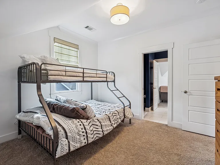 Bedroom 2 featuring a twin-over-queen bunkbed.