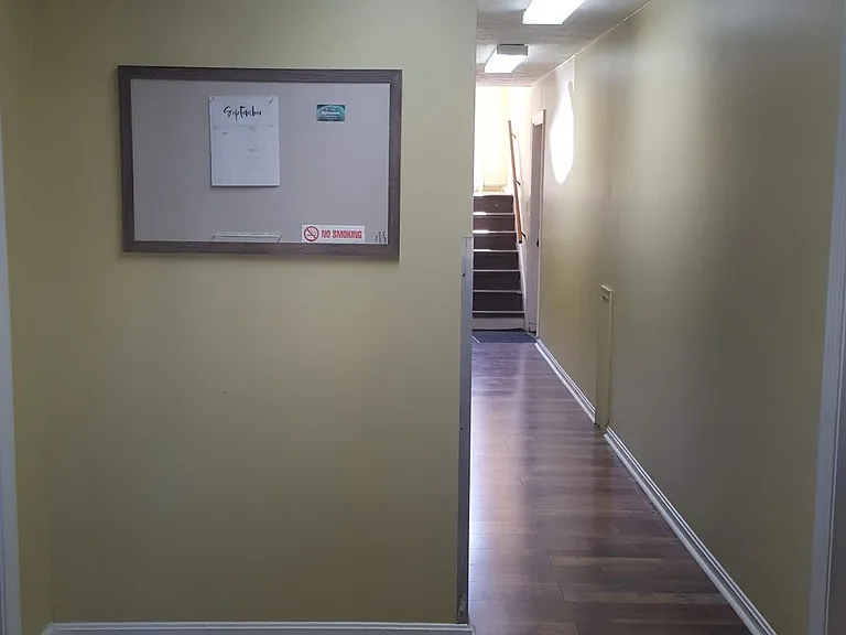 Front entrance to building. Communication board. 1st floor
