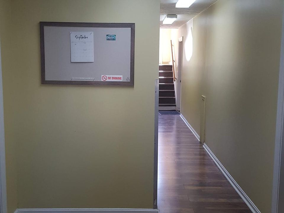 Front entrance to building. Communication board. 1st floor