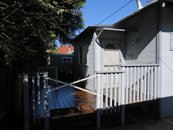 Deck (with fresh coat of water sealer stain)  and main entry