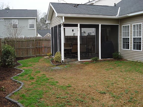 fenced in yard with screened in porch