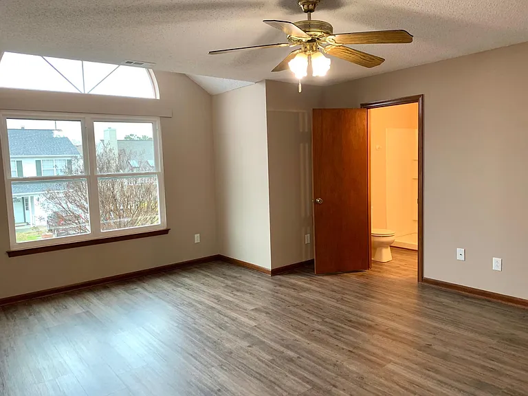 Extra large Primary Bedroom and Bathroom with Luxury Vinyl Plank flooring.