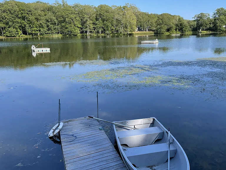 My rowboat and swim platform with life ring buoy and life preservers to wear