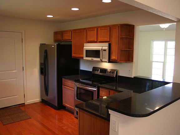 Updated kitchen with new cabentry, countertops, flooring, stainless appliacnes