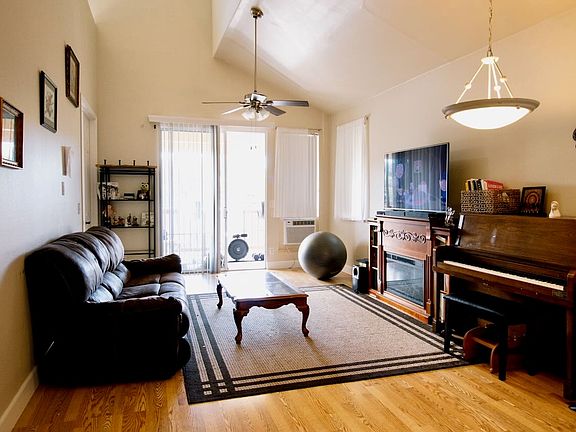 Spacious, open-concept living area with window A/C and private lanai.