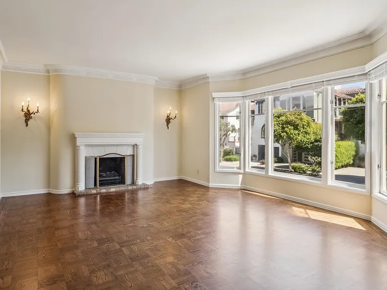 Formal living room with decorative fireplace