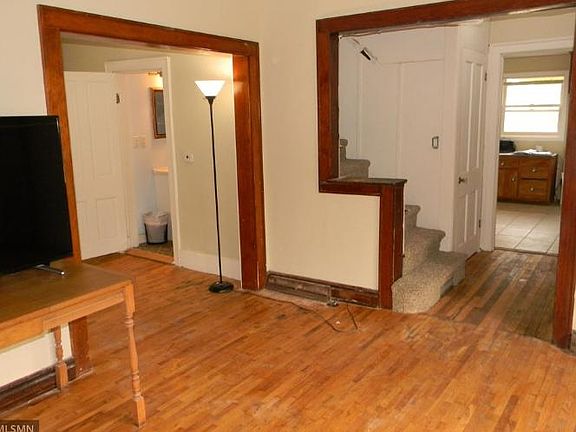 Living room with door to main level bath