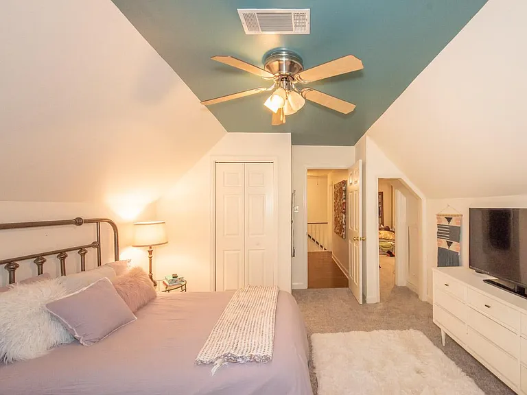 Upstairs bedroom with passthrough to additional bedroom.