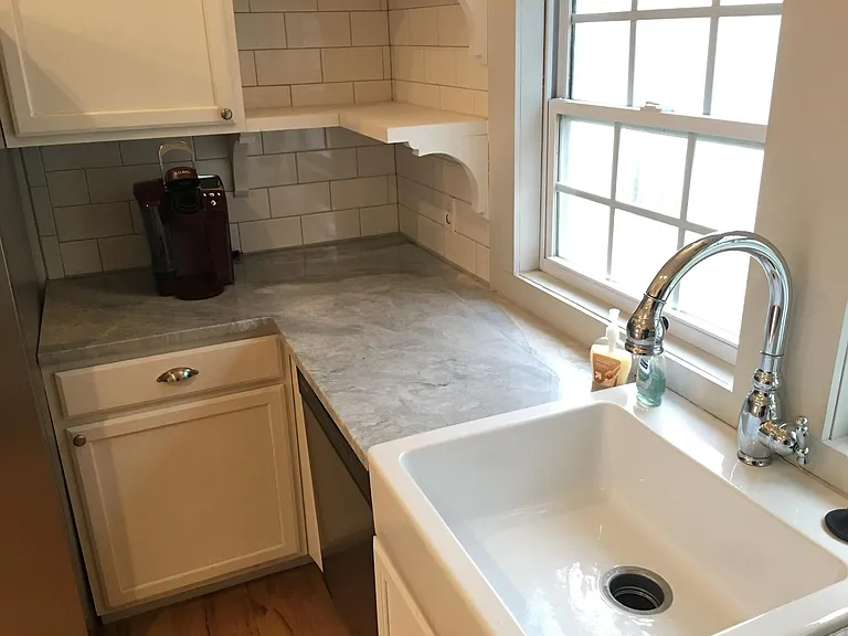 Kitchen sink, faucet and marble countertops
