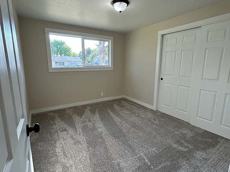 First bedroom, right side of hallway
