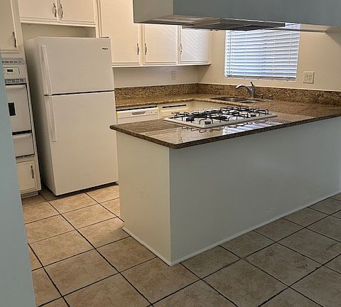 Kitchen includes refrigerator and brand new dishwasher.