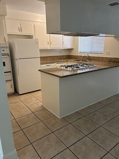 Kitchen includes refrigerator and brand new dishwasher.