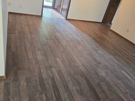Entryway and Living Room with Brand New Ceramic Tile Flooring Installed
