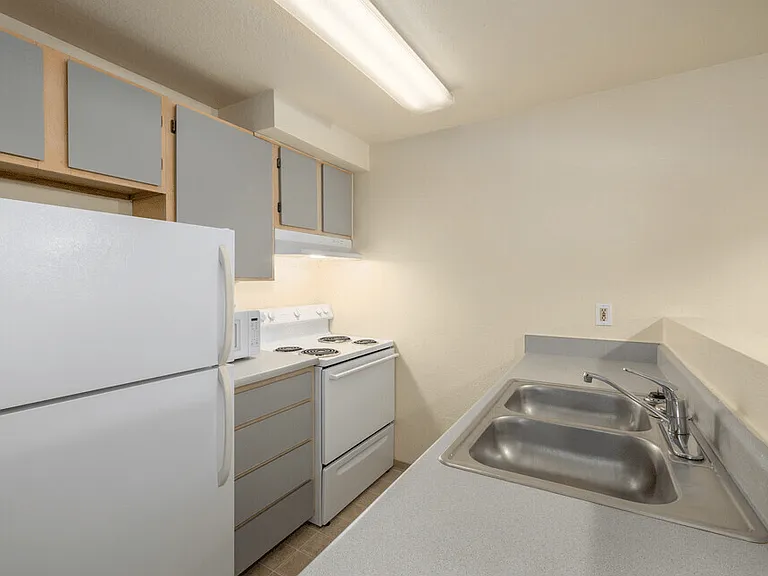 2-bedroom kitchen with oven, stove, refrigerator and microwave