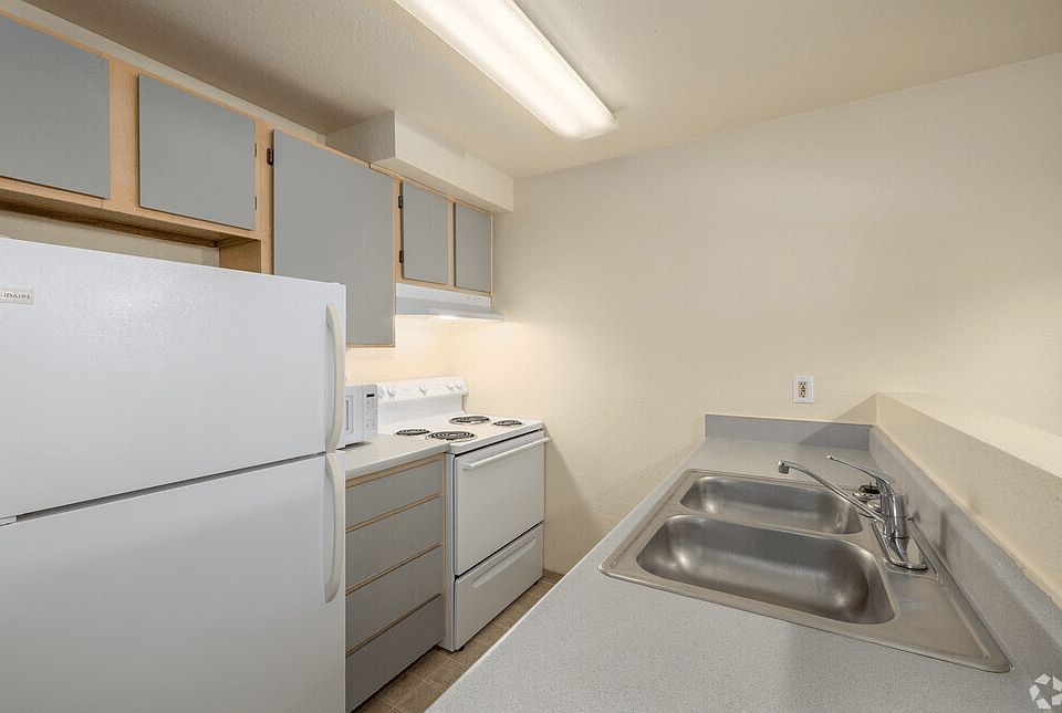 2-bedroom kitchen with oven, stove, refrigerator and microwave