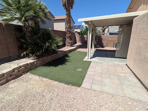 Backyard with covered patio - Iron Mountain Home For Rent