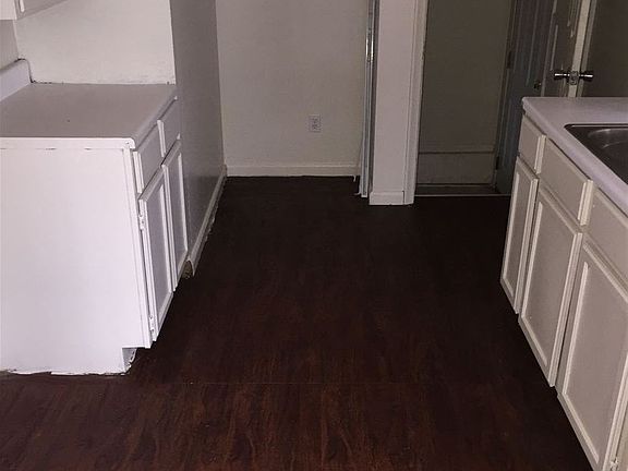 Kitchen with entry to side door and basement.