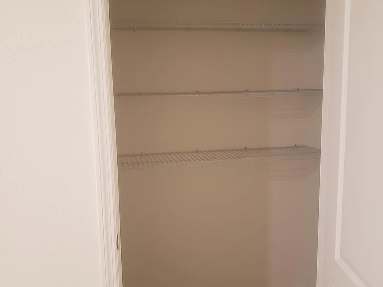 Huge master, tiled linen closet!