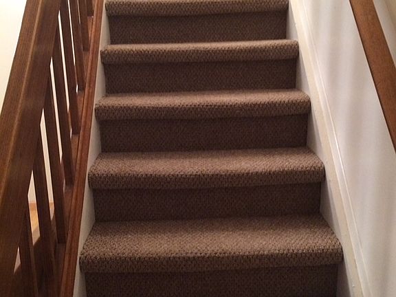Stairs up to bedrooms and main bath