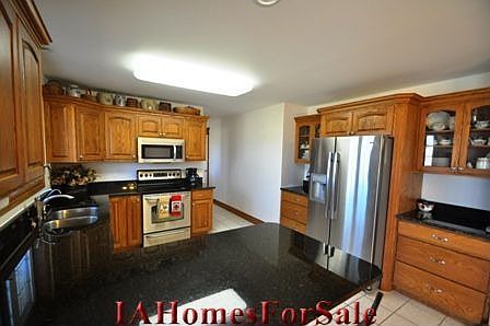 Kitchen with all stainless appliances & granite countertops