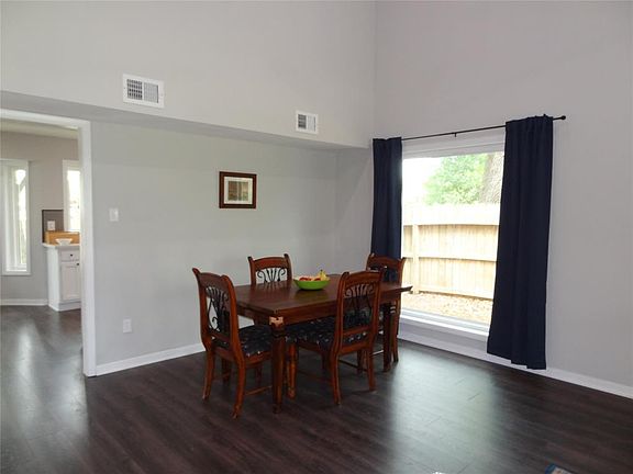 Formal dining area with easy access to kitchen. Check out this gorgeous picture window!