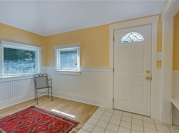 Generous entry room that could be used for an office or sitting area.