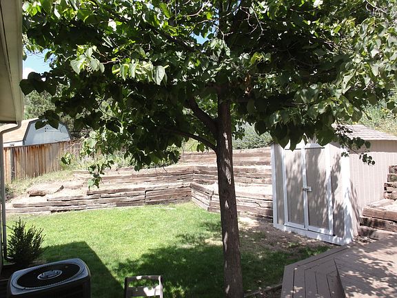 Rear grass, terrace, shed.