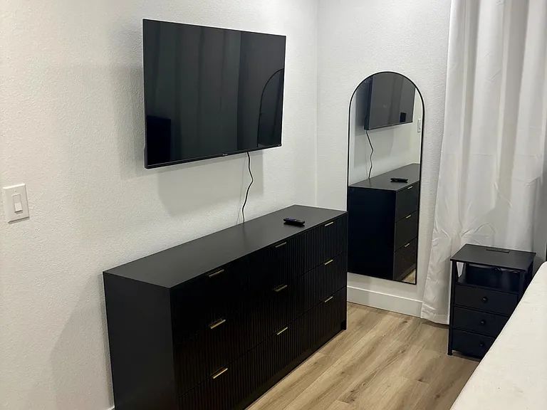Large dresser with Roku TV and full length mirror