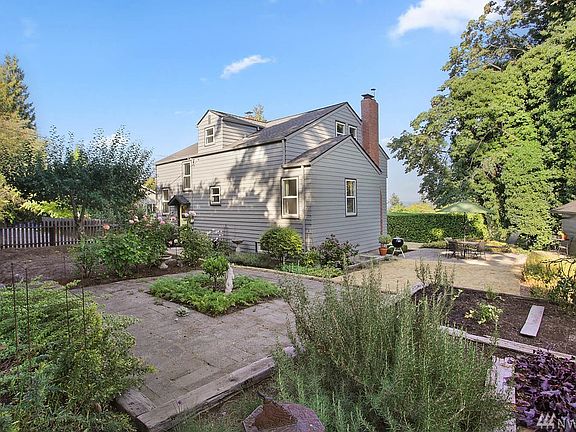 Charming, three-story home and expansive yard have been impeccably maintained. Marvin wood double-hung windows blend traditional beauty with state-of-the-art performance. Tesco storm windows and screens provide an additional layer of protection and comfort on every window.
