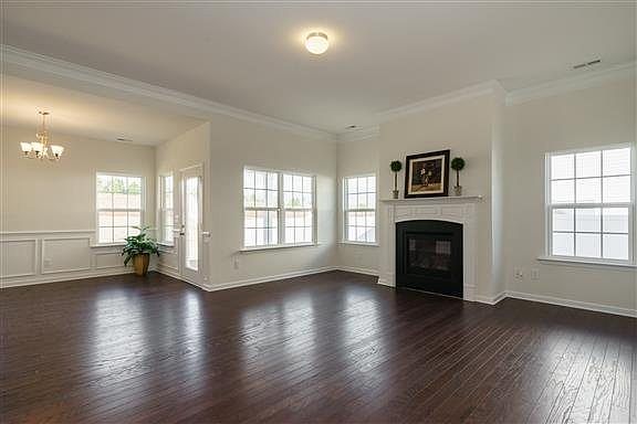 MODEL HOME PICTURED- Spacious Great Room with Gas Fireplace and Hardwood Floors Included!