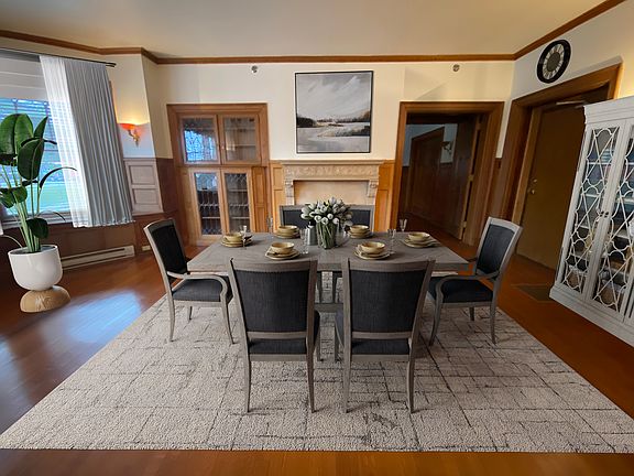 Dining Room with gas Fireplace and bay windows.