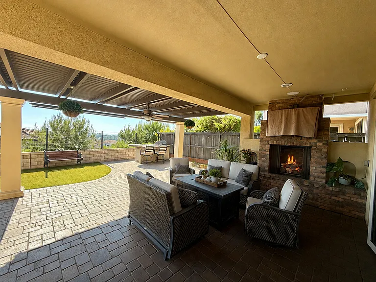Covered patio with fireplace & TV hookups