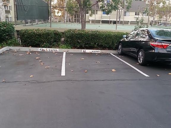 Your parking space and a full size tennis court!