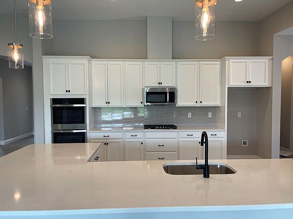 Sweet bay new construction quick move-in home plan designer gourmet kitchen at Cross Creek by Willia