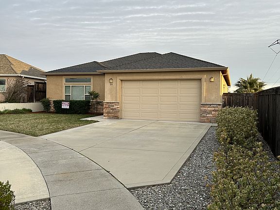 Front from sidewalk close to the property line and the end of the cul-de-sac.