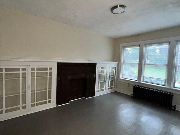 Living room features plenty of light and built in.