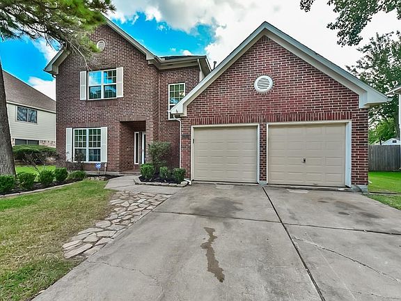 Double driveway and two car garage.