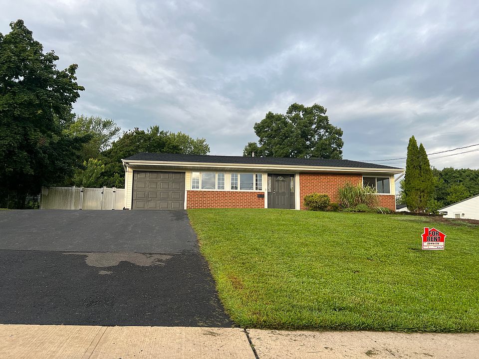 Front with 5 car paved driveway