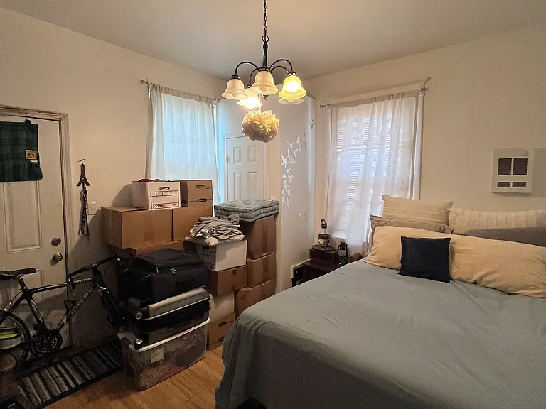 rear bedroom with closet and door to small outdoor space
