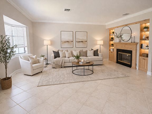 formal living area, with double sided fireplace and solid wood built-ins