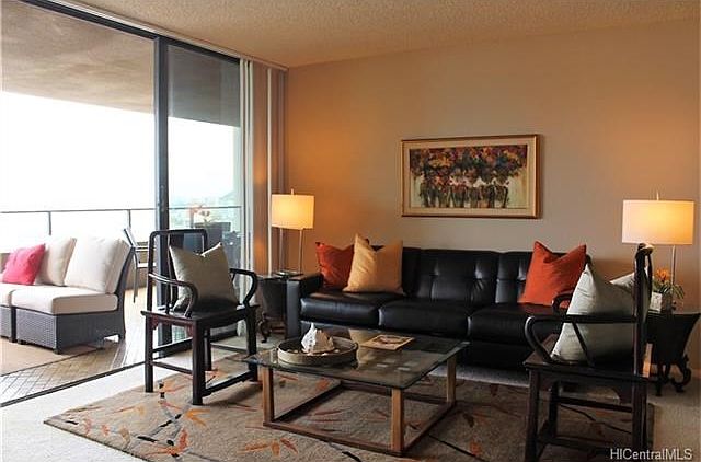 Living room opens to large, very useable lanai