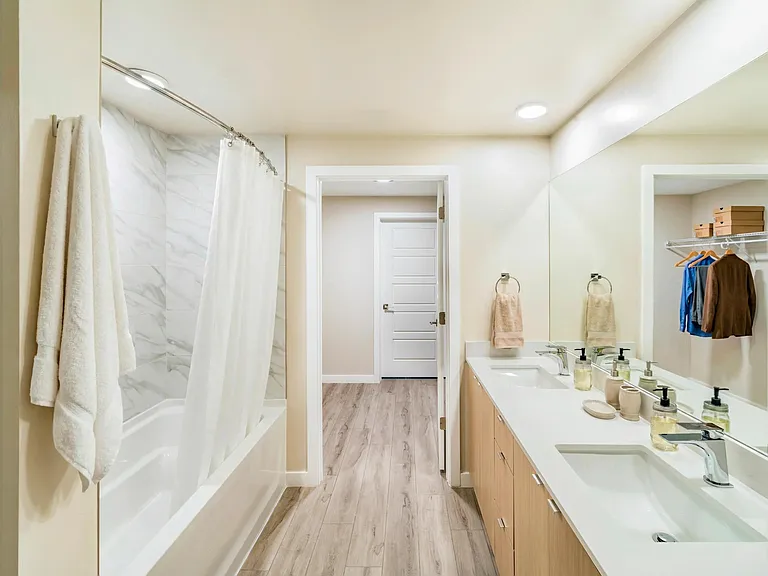 Select from multiple finish packages_each pairing sleek countertops with modern wood cabinetry_at Modera Coral Springs North Tower.