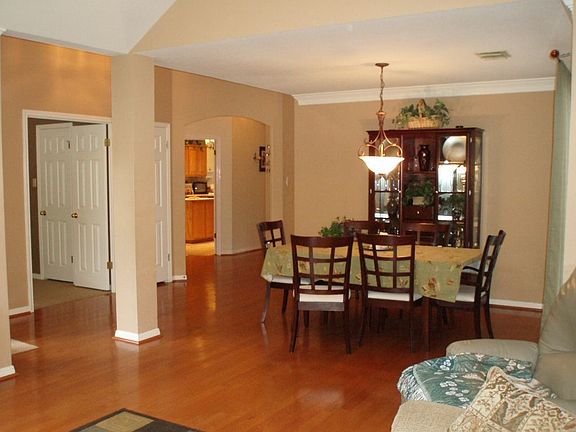 Formal living and formal dining room with wood floors