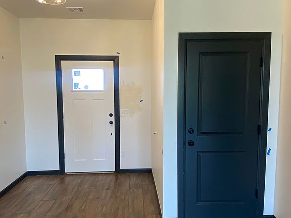 Front Door and Door leading to Garage