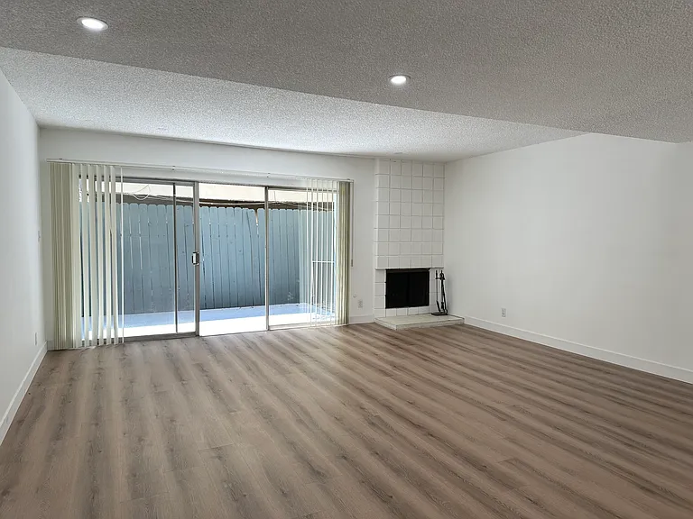 Livingroom with fire place and private patio