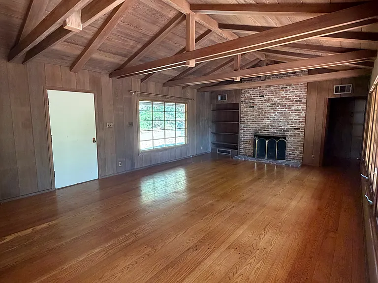 Living area with view of front windows and main entrance