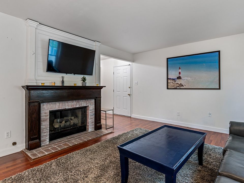 Beautiful decorative (non-functional) fireplace with room for big-screen tv.