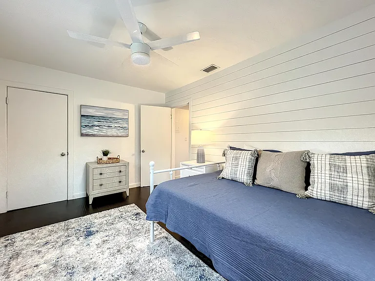 Front Bedroom/Office - blackout shades and sit/stand desk with monitor