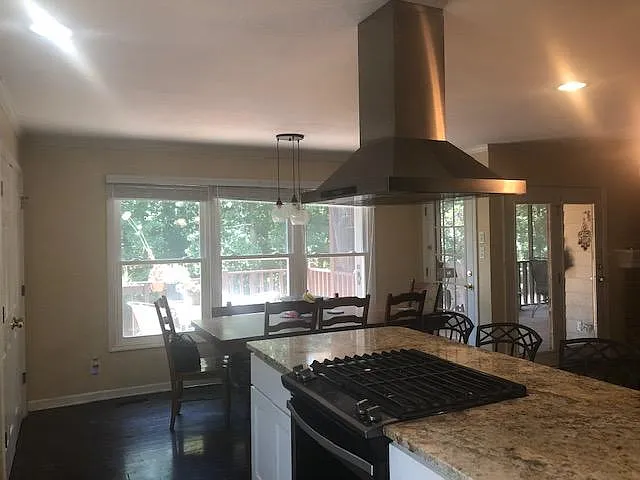 Kitchen island and hood. - 665 Tree Ridge Rd