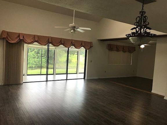living room showing bonus room- 3rd bedroom option